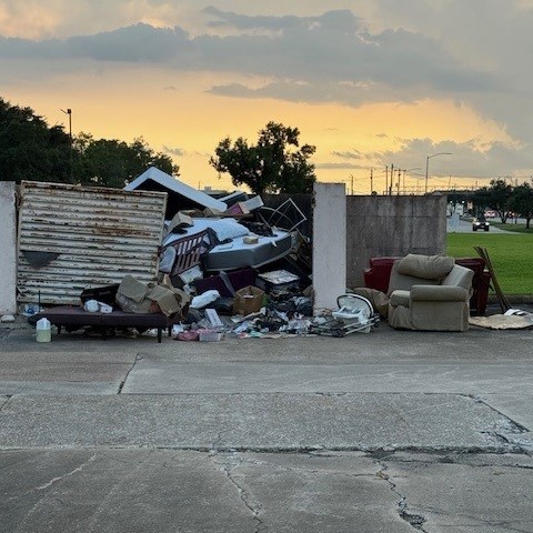 Apartment community bulk trash removal including mattresses and dumpster area cleanup in Houston Texas