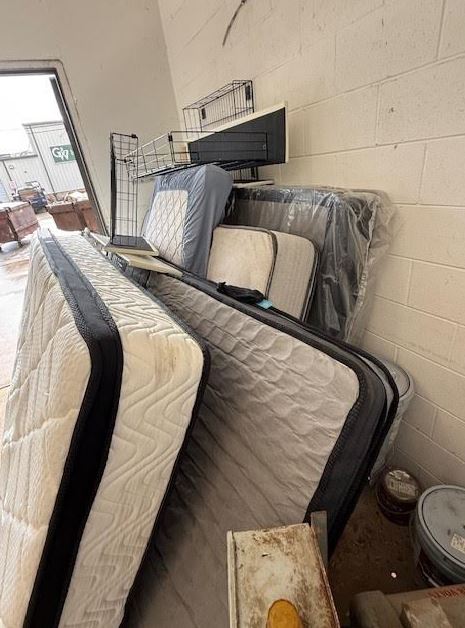Apartment mattress removal and bulk trash cleanup at apartment complex in Houston Texas